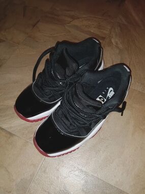 Nike Air Jordan 11 Low-Style Sneakers in Black and Red